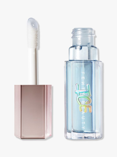 Fenty Beauty Gloss Bomb Ice Cooling Lip Luminizer vial of blue lip gloss on light gray background